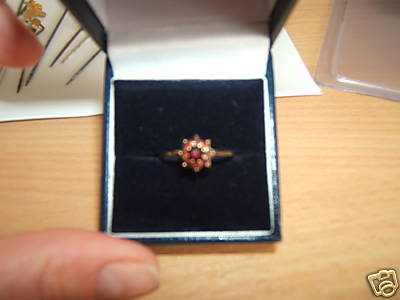 Gold ring with garnet stones